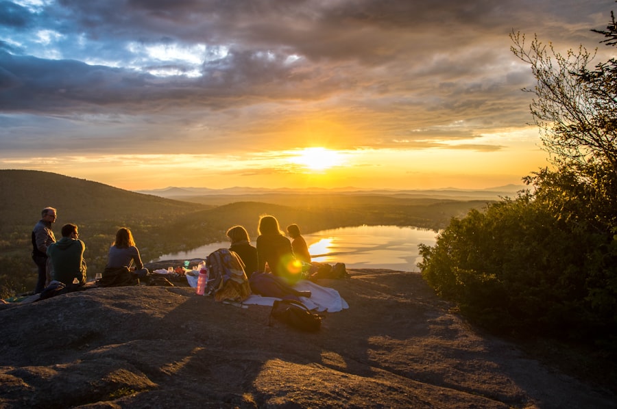 A group watching the sunset together from a scenic overlook